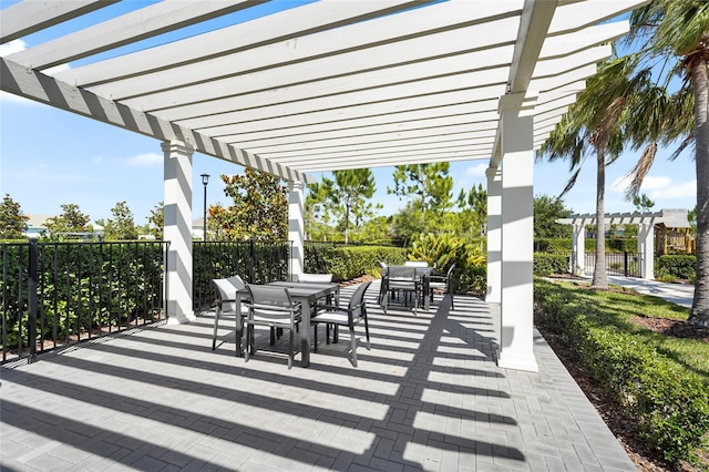 8229 Grande Shores Dr, Sarasota, FL 34240 - view of patio with a pergola and outdoor dining area