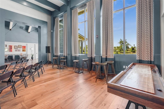 8229 Grande Shores Dr, Sarasota, FL 34240 - rec room featuring hardwood / wood-style floors and a high ceiling