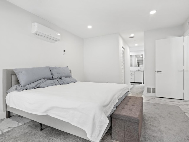 bedroom featuring visible vents, a wall unit AC, recessed lighting, and marble finish floor