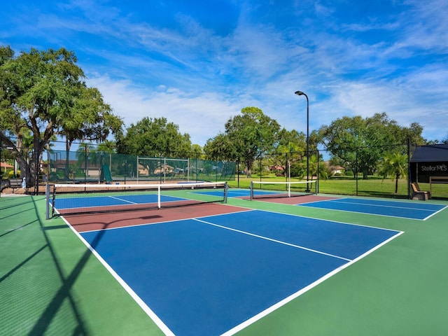 view of sport court with fence and community basketball court