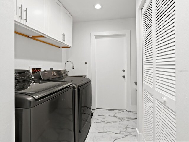 172 Sea Anchor Dr, Osprey, FL 34229 - laundry room with cabinet space, independent washer and dryer, light marble finish floors, and recessed lighting