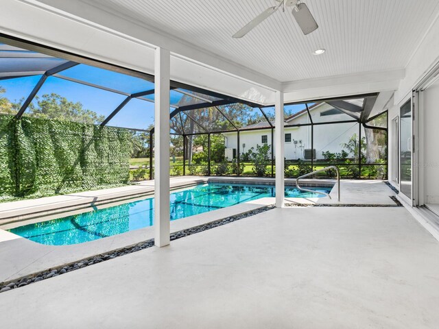172 Sea Anchor Dr, Osprey, FL 34229 - outdoor pool with a patio, a ceiling fan, and a lanai