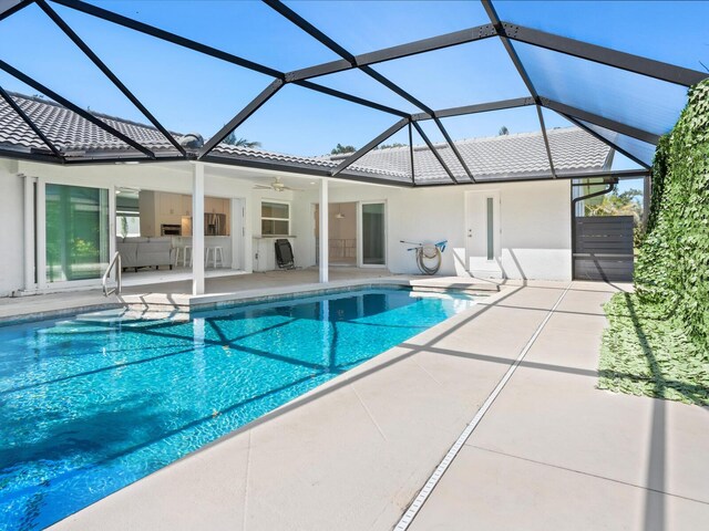 172 Sea Anchor Dr, Osprey, FL 34229 - swimming pool featuring a patio, a lanai, and a ceiling fan