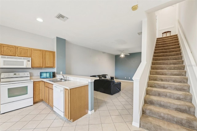 2353 Rosewood Ln, North Port, FL 34289 - kitchen featuring white appliances, a sink, light tile patterned flooring, open floor plan, and a peninsula