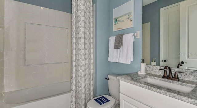 full bathroom with shower / tub combo with curtain, toilet, and vanity