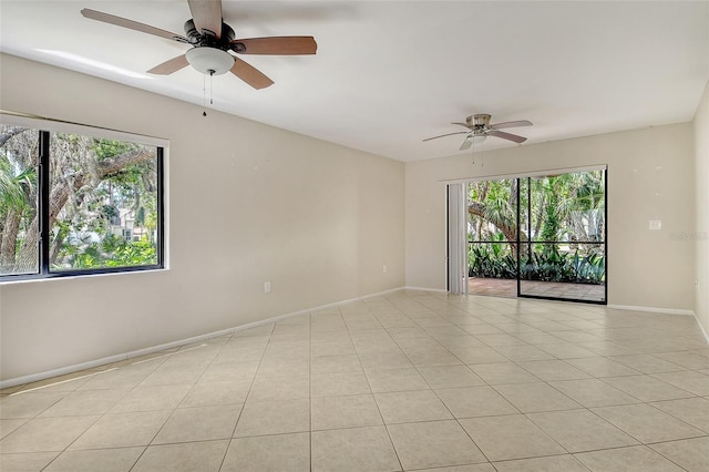 7876 Eagle Creek Dr, Sarasota, FL 34243 - unfurnished room with ceiling fan, baseboards, and light tile patterned flooring