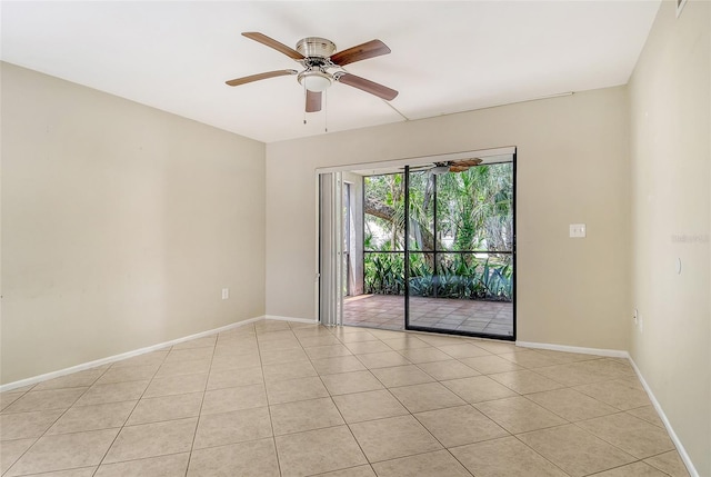 7876 Eagle Creek Dr, Sarasota, FL 34243 - unfurnished room featuring light tile patterned floors, a ceiling fan, and baseboards