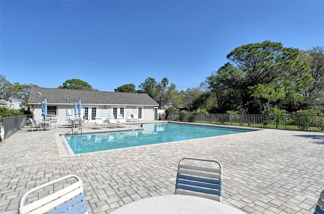 7876 Eagle Creek Dr, Sarasota, FL 34243 - community pool featuring french doors, fence, and a patio area