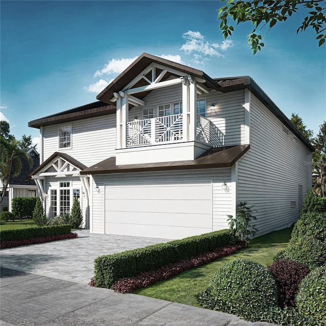 view of front of home with a garage, a balcony, and driveway