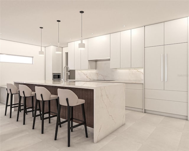 kitchen with stainless steel microwave, white cabinets, a sink, a large island, and modern cabinets