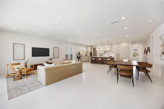 2596 Floyd St, Sarasota, FL 34239 - living room with recessed lighting, healthy amount of natural light, and concrete flooring