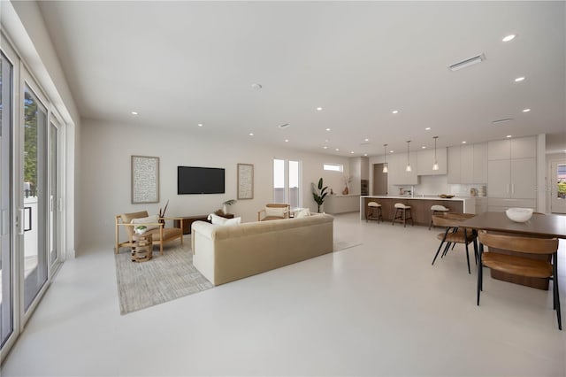 2596 Floyd St, Sarasota, FL 34239 - living room with recessed lighting and concrete flooring