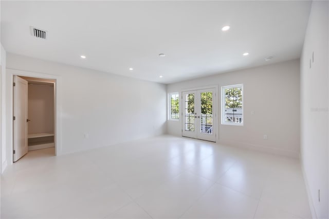 2596 Floyd St, Sarasota, FL 34239 - spare room featuring french doors and recessed lighting