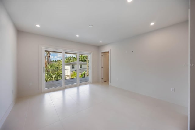 2596 Floyd St, Sarasota, FL 34239 - empty room with recessed lighting and light tile patterned flooring