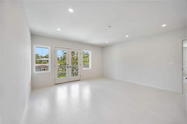 2596 Floyd St, Sarasota, FL 34239 - unfurnished room featuring french doors, recessed lighting, and tile patterned floors