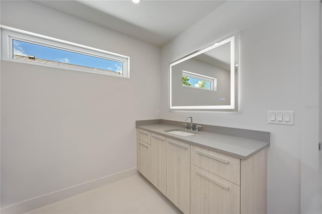 2596 Floyd St, Sarasota, FL 34239 - bathroom featuring healthy amount of natural light, vanity, and baseboards
