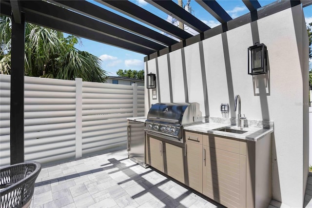 2596 Floyd St, Sarasota, FL 34239 - view of patio with a sink, area for grilling, and a pergola