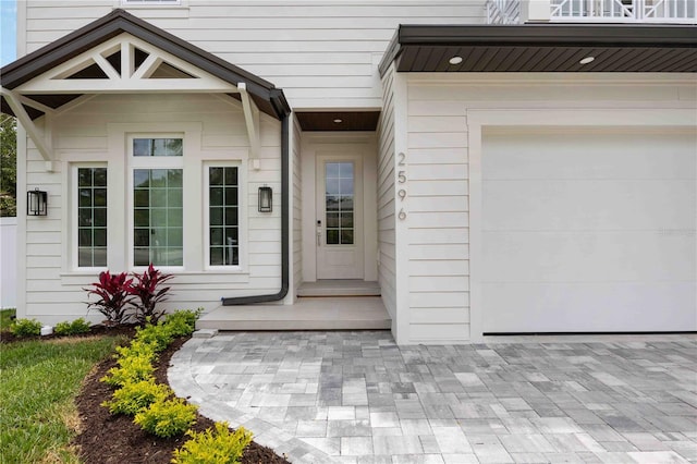 2596 Floyd St, Sarasota, FL 34239 - view of exterior entry featuring a garage