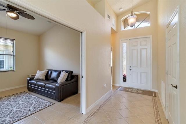 6519 43rd Ct E, Sarasota, FL 34243 - foyer entrance featuring light tile patterned floors, a wealth of natural light, and a ceiling fan