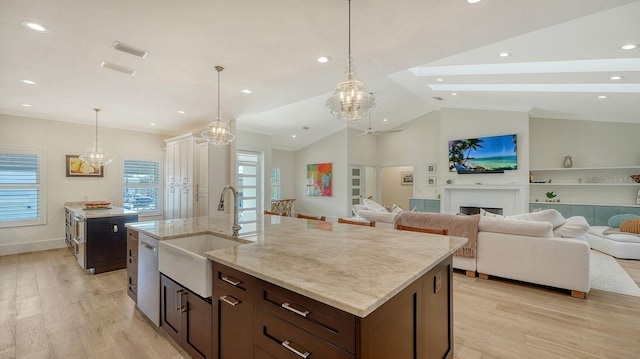 345 Madison Dr, Sarasota, FL 34236 - kitchen featuring visible vents, open floor plan, a sink, light wood finished floors, and dishwasher