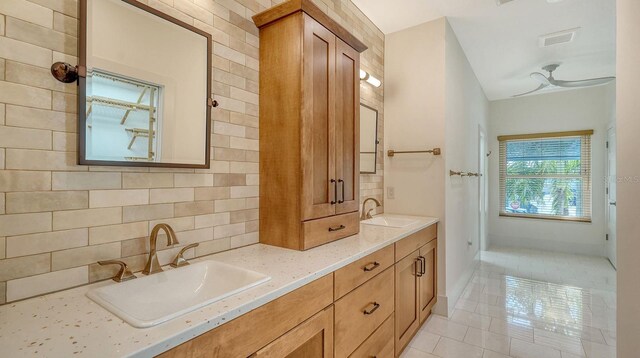 345 Madison Dr, Sarasota, FL 34236 - full bathroom featuring double vanity, a sink, tile patterned flooring, and tasteful backsplash