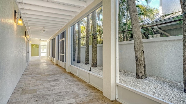 345 Madison Dr, Sarasota, FL 34236 - unfurnished sunroom featuring ceiling fan and beam ceiling