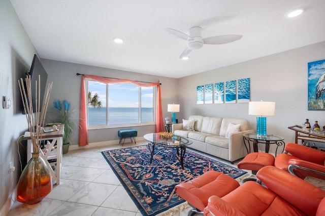 living room with recessed lighting, a ceiling fan, marble finish floor, and baseboards