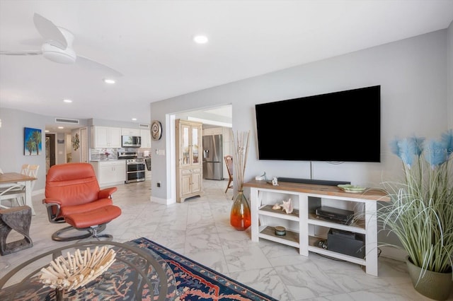 living area with ceiling fan, recessed lighting, visible vents, and marble finish floor