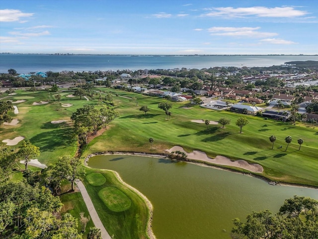 aerial view with a water view, view of golf course, and a residential view