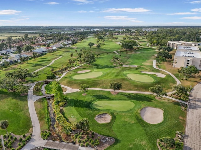 birds eye view of property with view of golf course