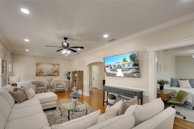 1814 6th Ave W, Bradenton, FL 34205 - living area with crown molding, arched walkways, wood finished floors, and visible vents