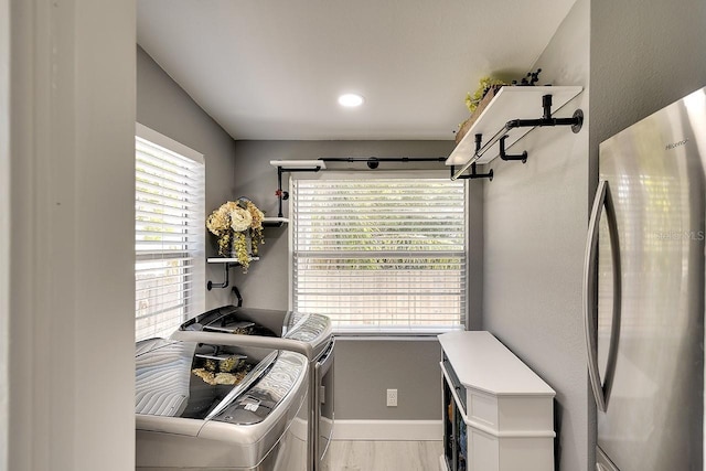 1814 6th Ave W, Bradenton, FL 34205 - laundry area with laundry area, washing machine and dryer, baseboards, light wood-style floors, and recessed lighting