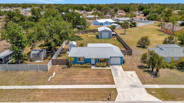 birds eye view of property with a residential view