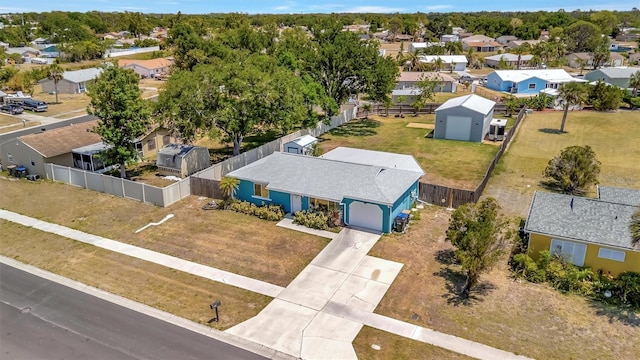 birds eye view of property with a residential view