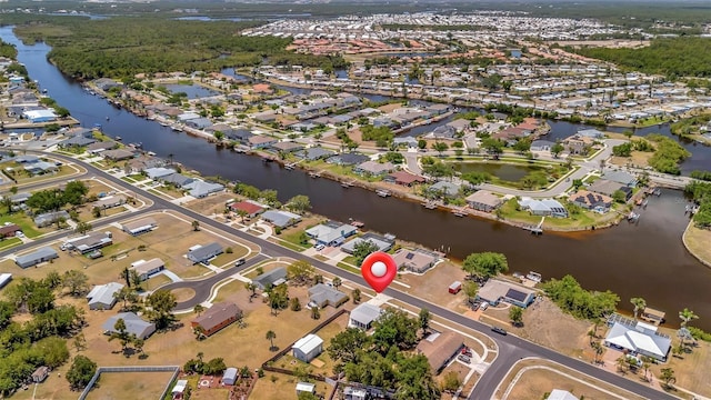 aerial view with a residential view and a water view