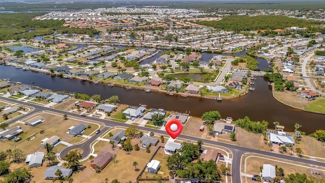 birds eye view of property featuring a residential view and a water view