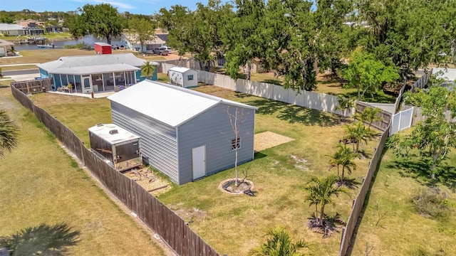 drone / aerial view with a residential view and a water view