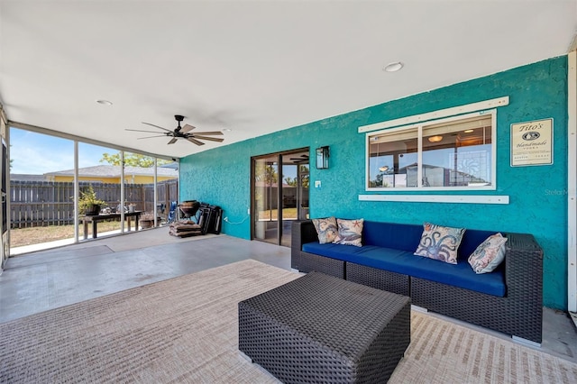 sunroom featuring an outdoor hangout area and ceiling fan