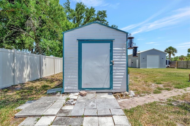 view of shed with a fenced backyard