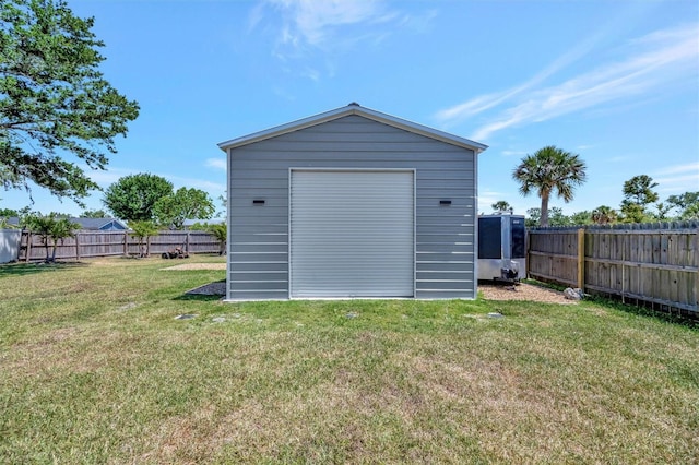 view of shed with a fenced backyard