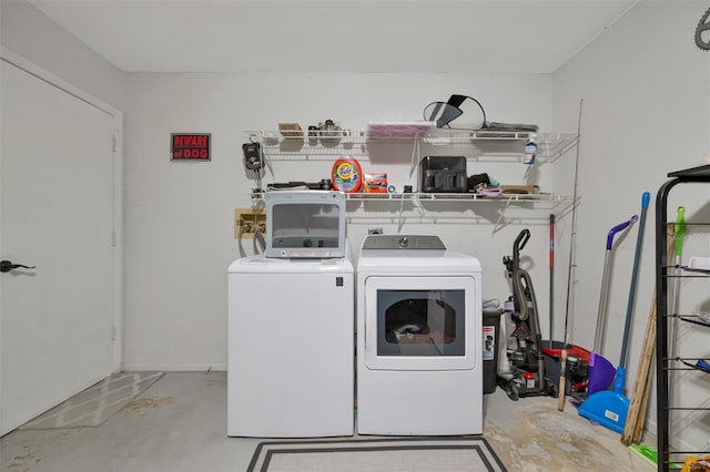 washroom featuring independent washer and dryer and laundry area