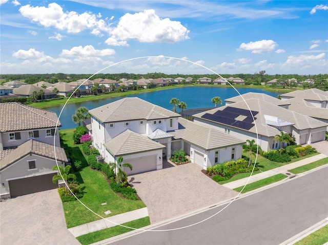 aerial view featuring a water view and a residential view