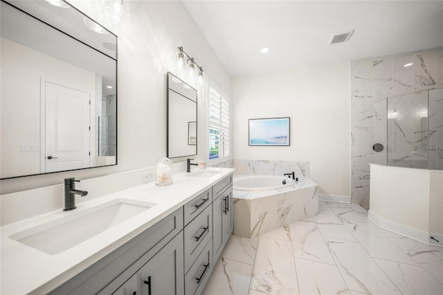 full bath with visible vents, a sink, marble finish floor, and a bath