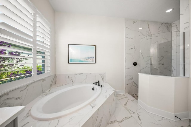 bathroom with a marble finish shower, plenty of natural light, a bath, and marble finish floor