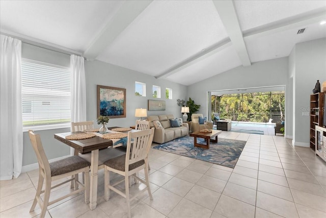 dining room featuring light tile patterned floors, baseboards, visible vents, and vaulted ceiling with beams