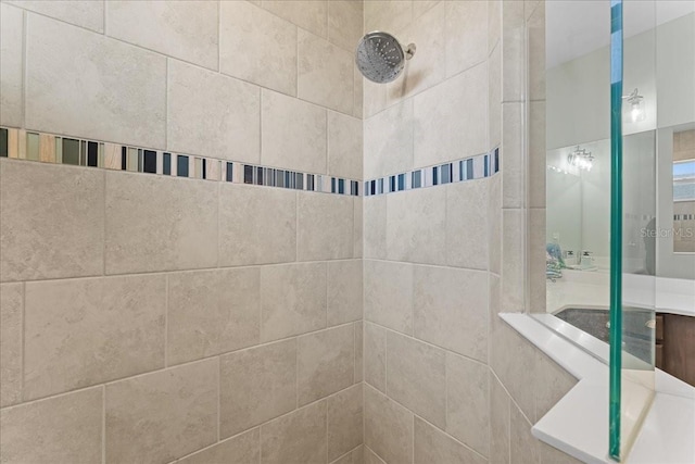 full bath with tiled shower