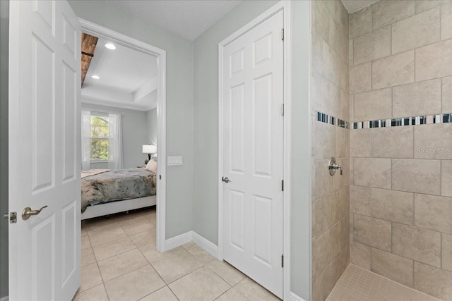 bathroom featuring baseboards, tiled shower, recessed lighting, connected bathroom, and tile patterned floors