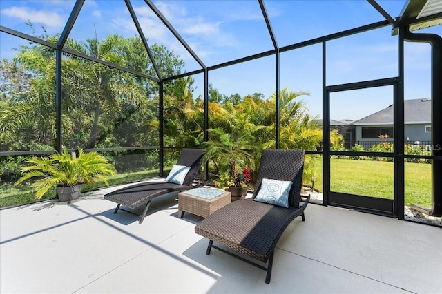 view of patio with glass enclosure