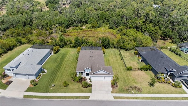 birds eye view of property with a forest view