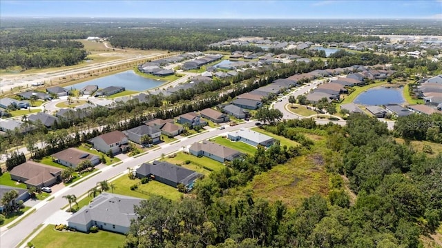 bird's eye view featuring a water view and a residential view